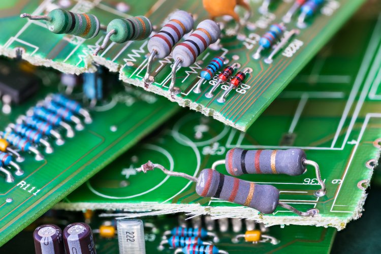 Close-up of broken circuit boards for electronic media destruction
