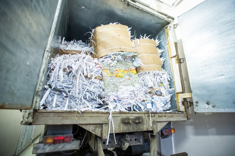 Truck loaded with shredded paper bundles for off-site shredding service