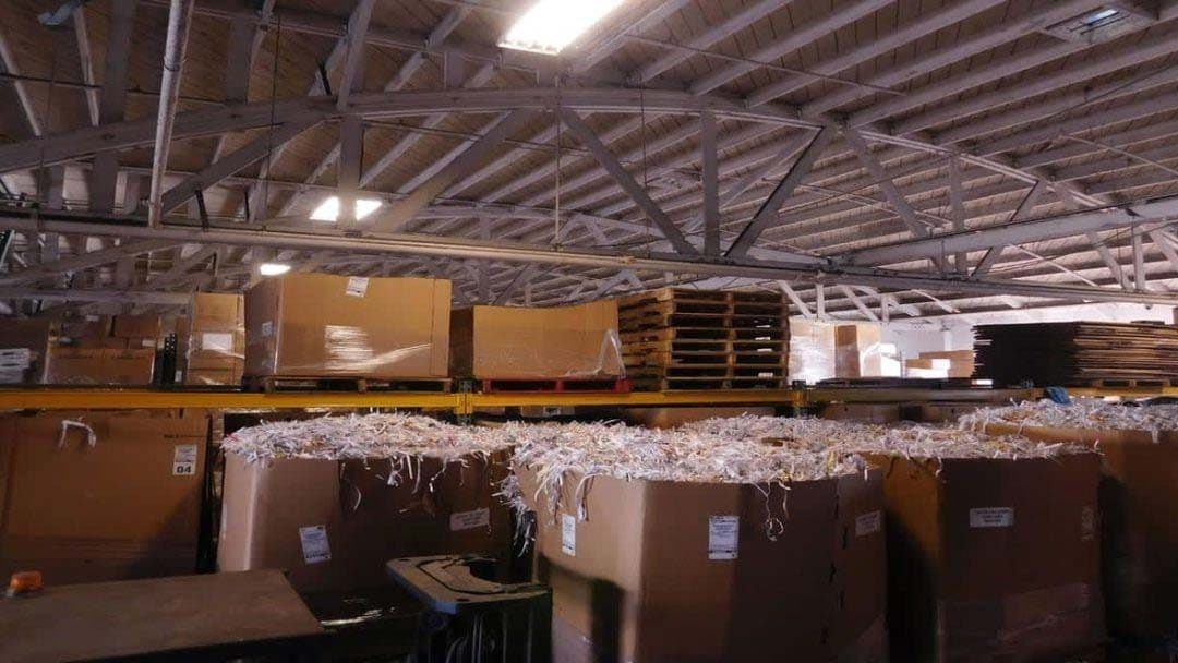 Large cardboard boxes filled with shredded paper inside a warehouse in Los Angeles, CA
